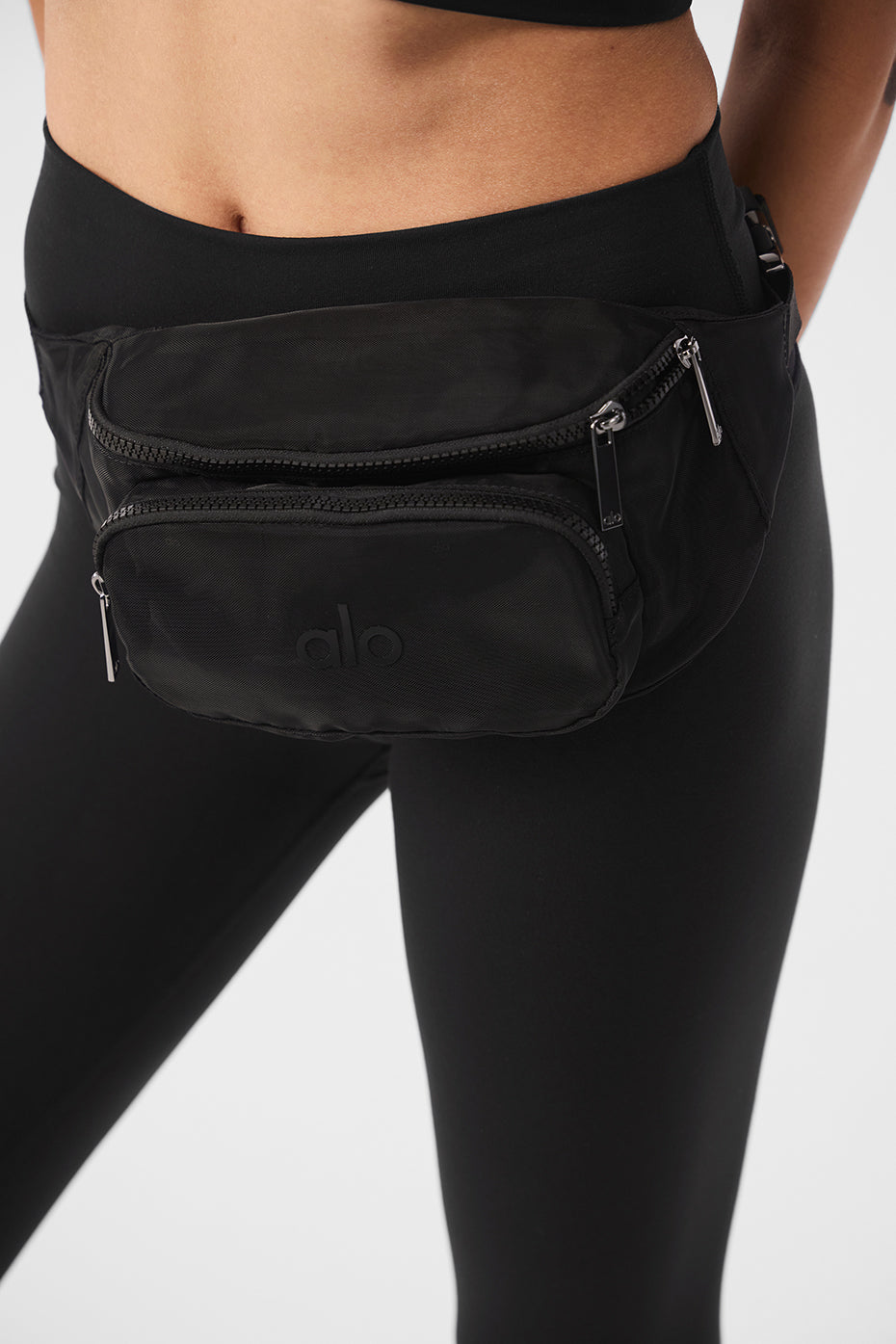 Front view of the transparent mesh fanny pack, showcasing its spacious compartments.
