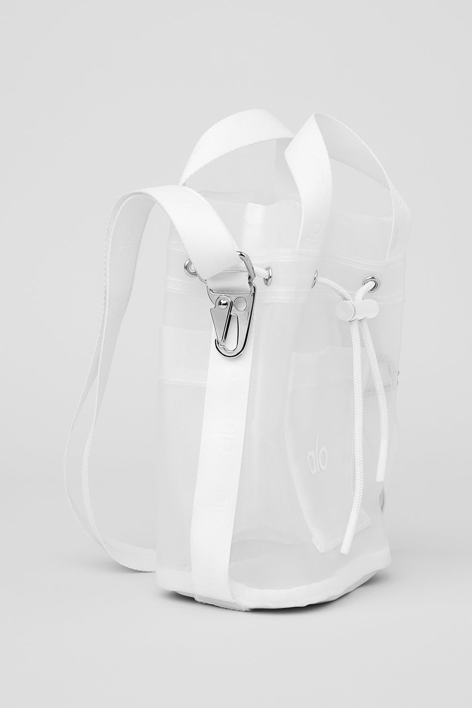 White sheer cross body bucket bag with adjustable strap and drawstring closure.