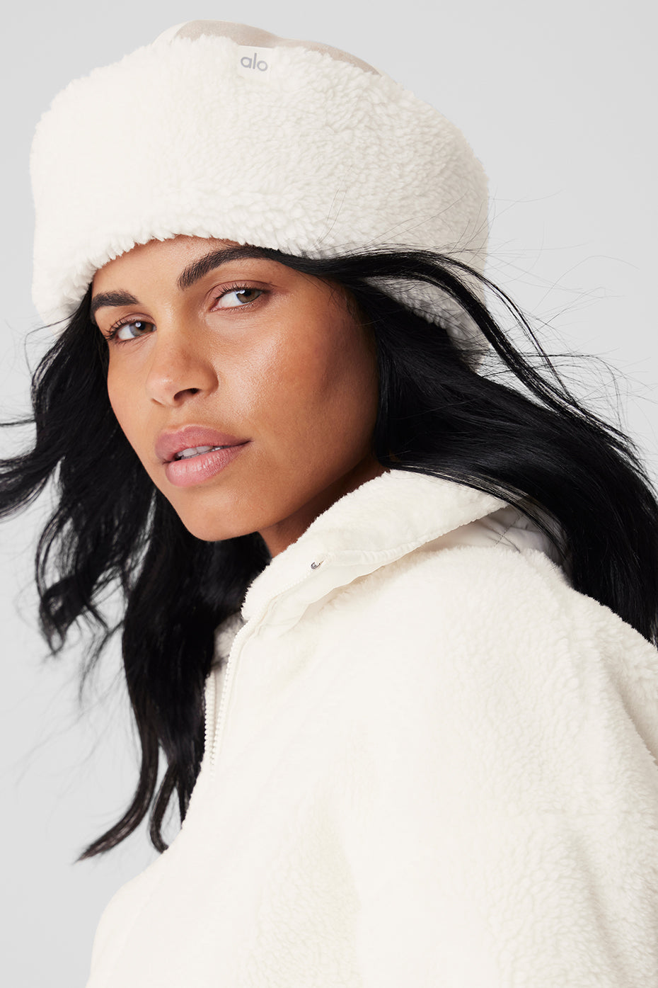 Front view of womens winter hat in oat ivory with faux leather trim