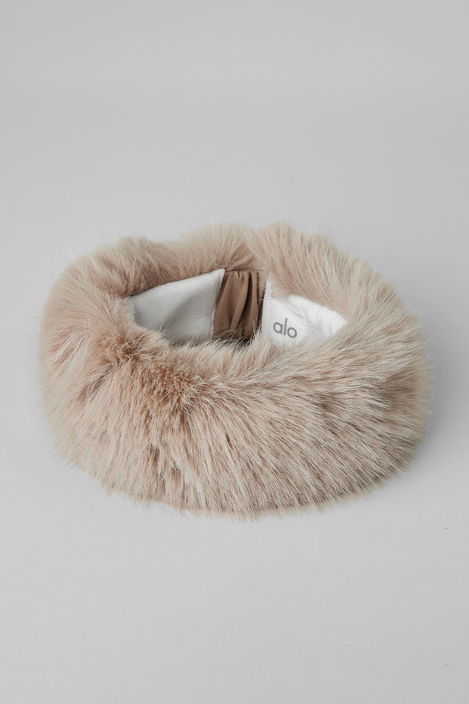 Close-up of the fleece lining in the faux fur headband for warmth.