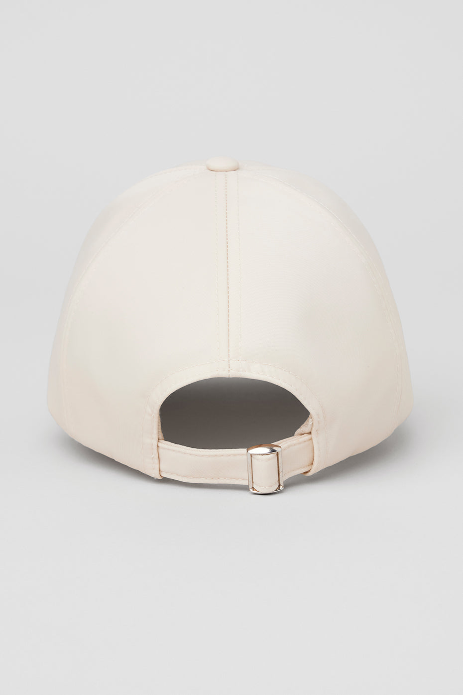 Close-up of the satin caps luxurious fabric and adjustable back buckle.