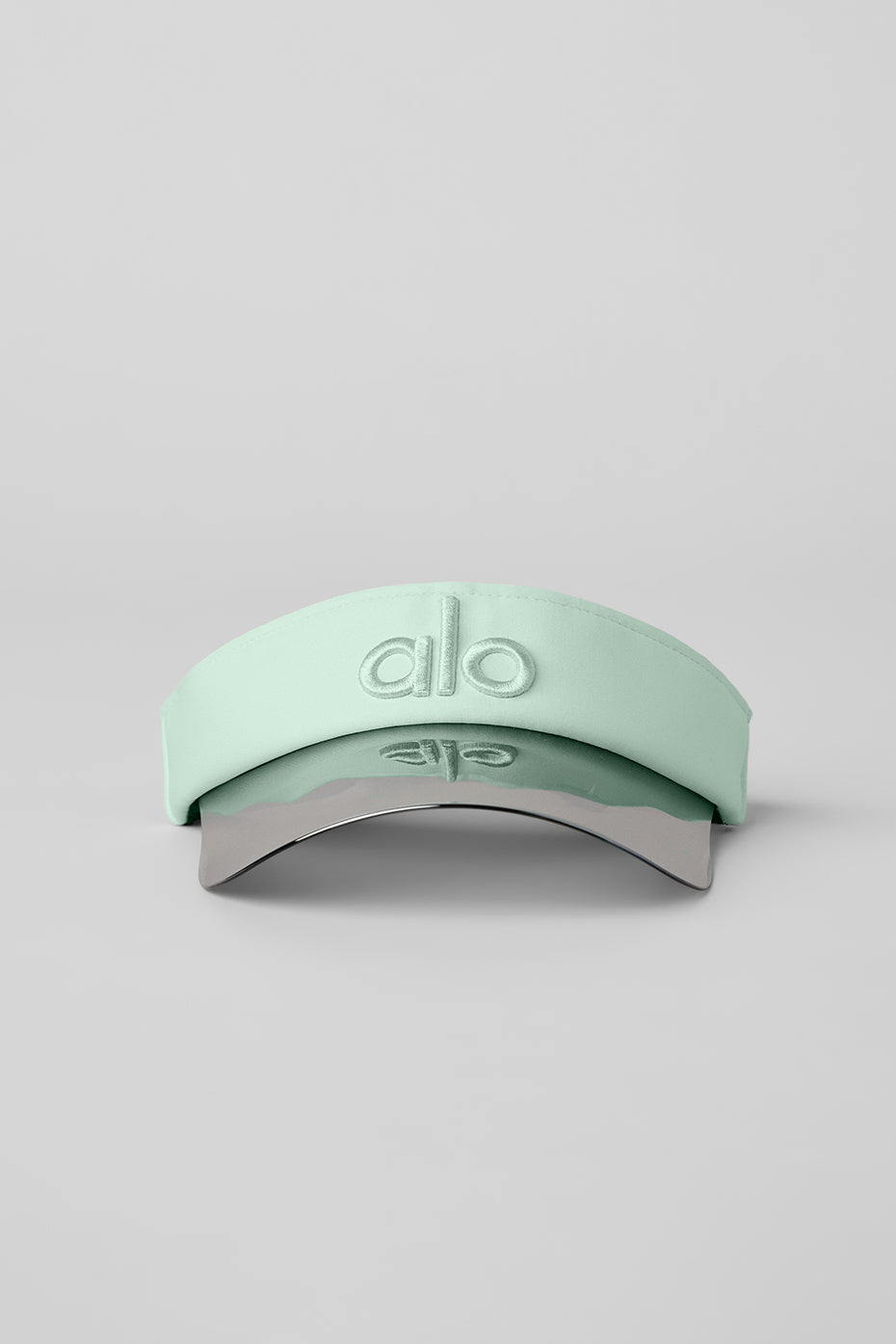 Side view of visor highlighting adjustable buckle and fabric texture