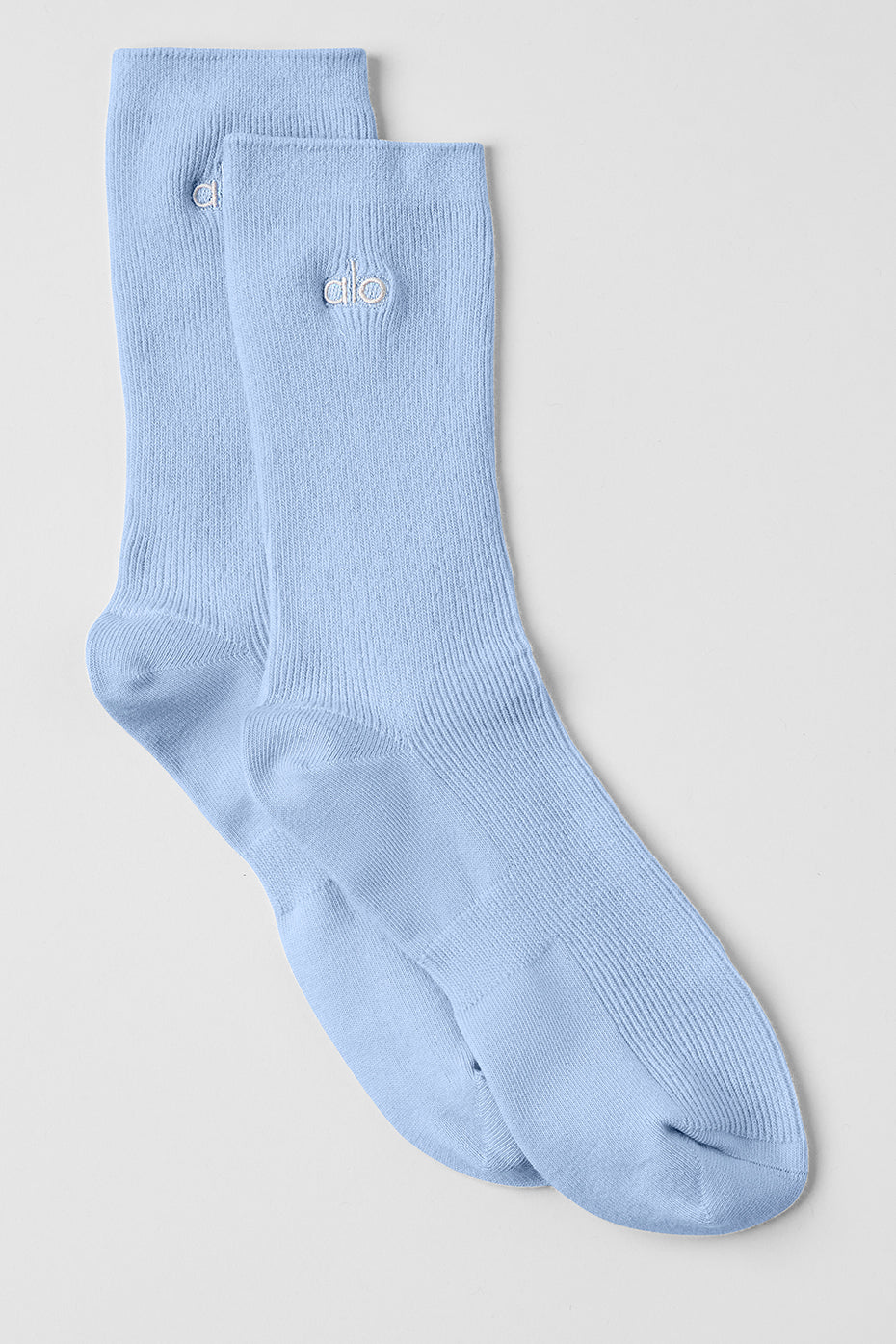 Front view of ALO half crew socks in seashell blue, perfect for daily wear.