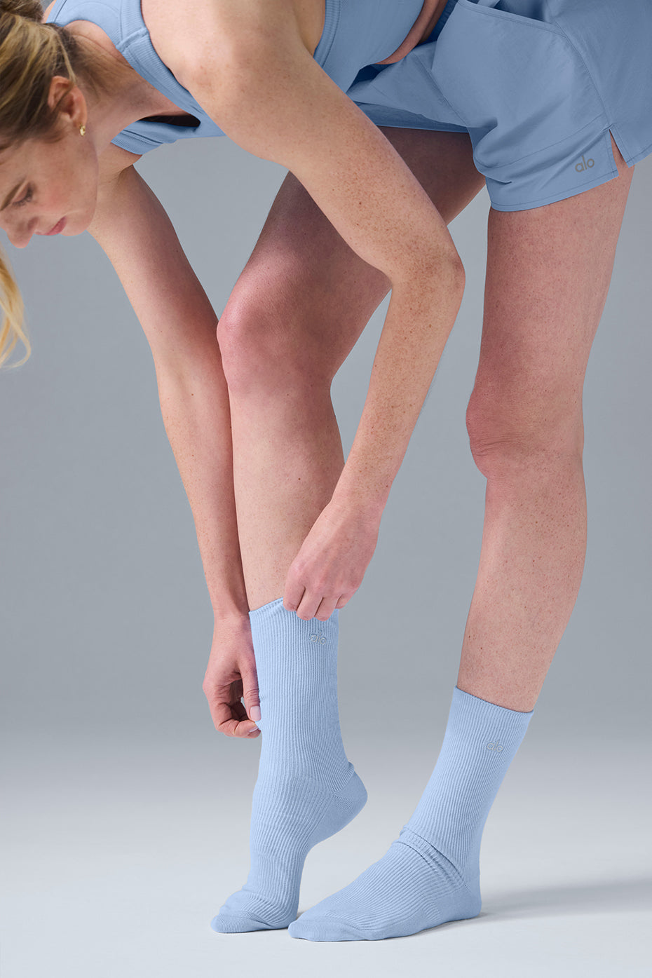 Front view of ALO half crew socks in seashell blue, perfect for daily wear.