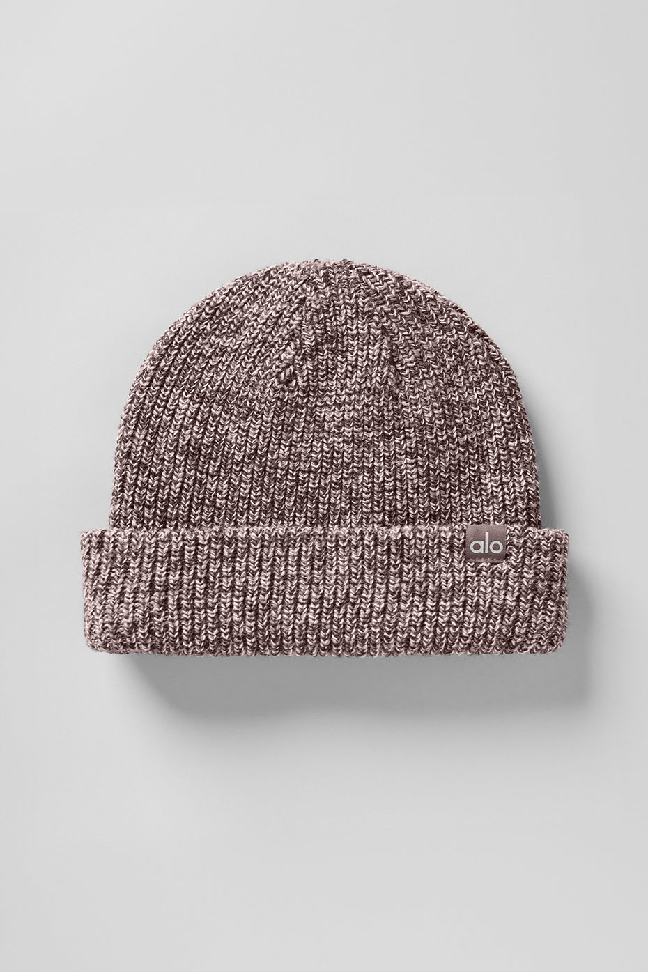 Mushroom marl beanie worn outdoors during chilly weather, perfect for men.