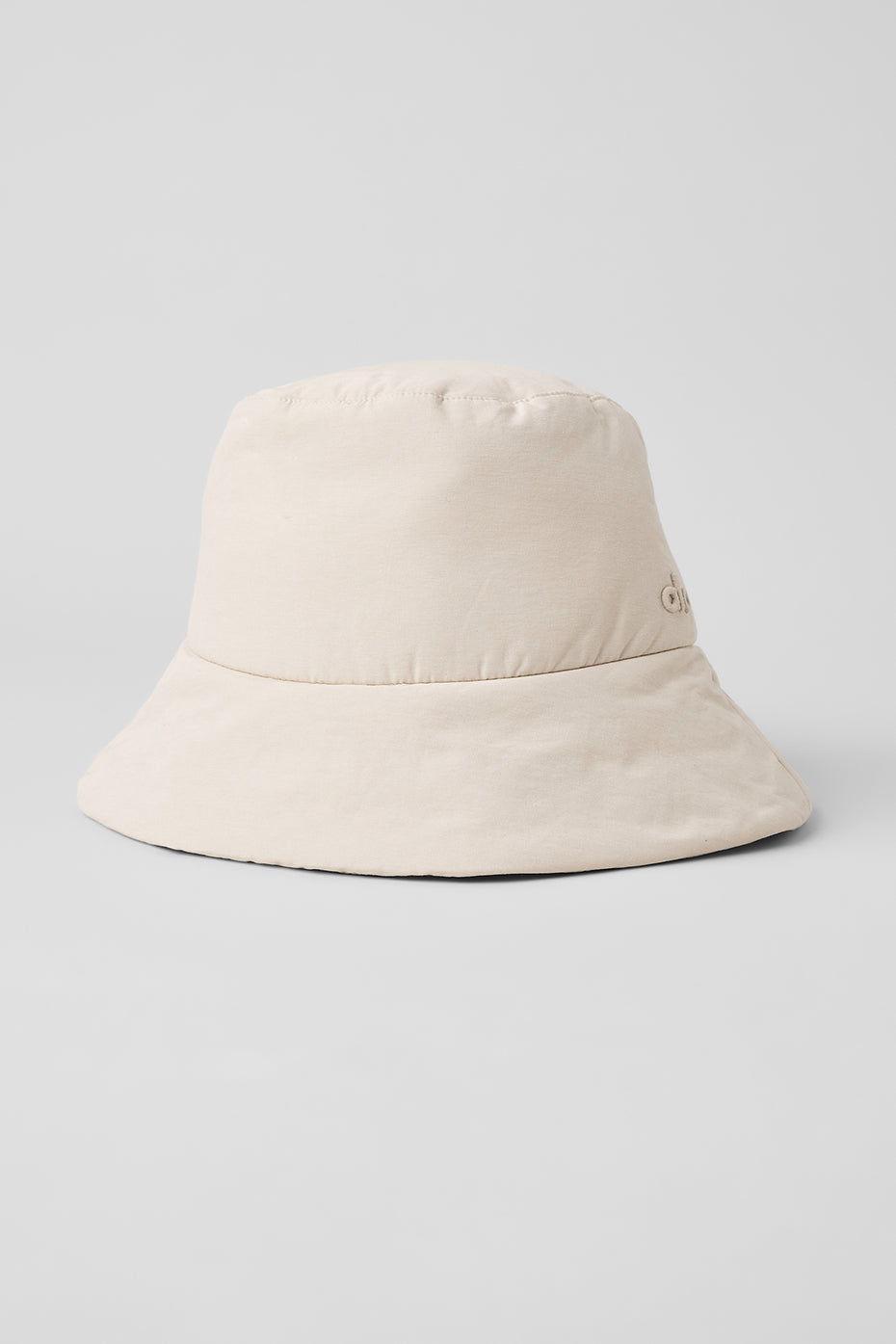 Person wearing summer hats at a beach café