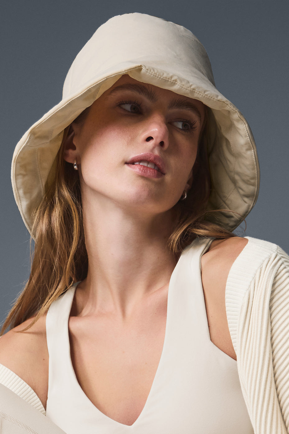 Side view of crochet bucket hat on a wooden bench