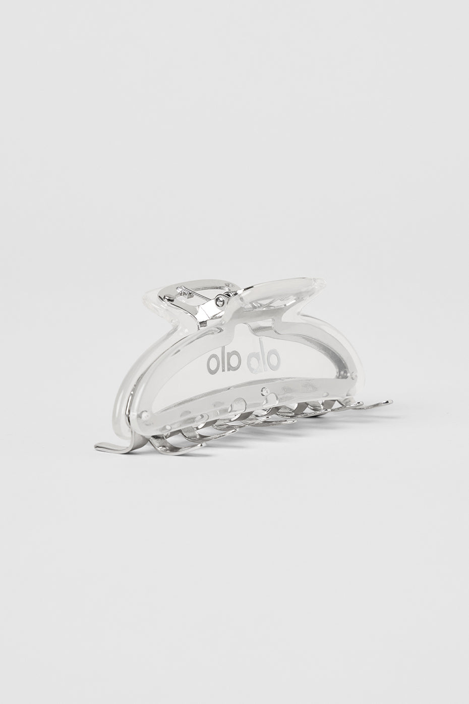 Sleek acrylic claw clip in clear with chrome accents, ideal for thick hair.