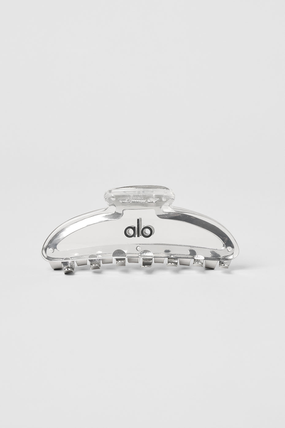 Close-up of the stylish claw clip gripping thick hair, showcasing its strength.