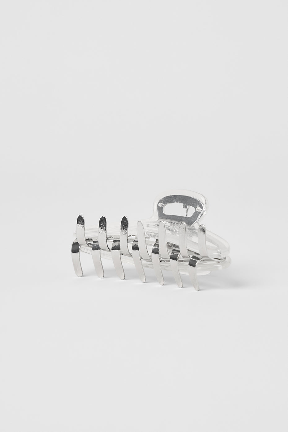 Elegant acrylic claw clip displayed on a vanity, perfect for wedding hair accessories.