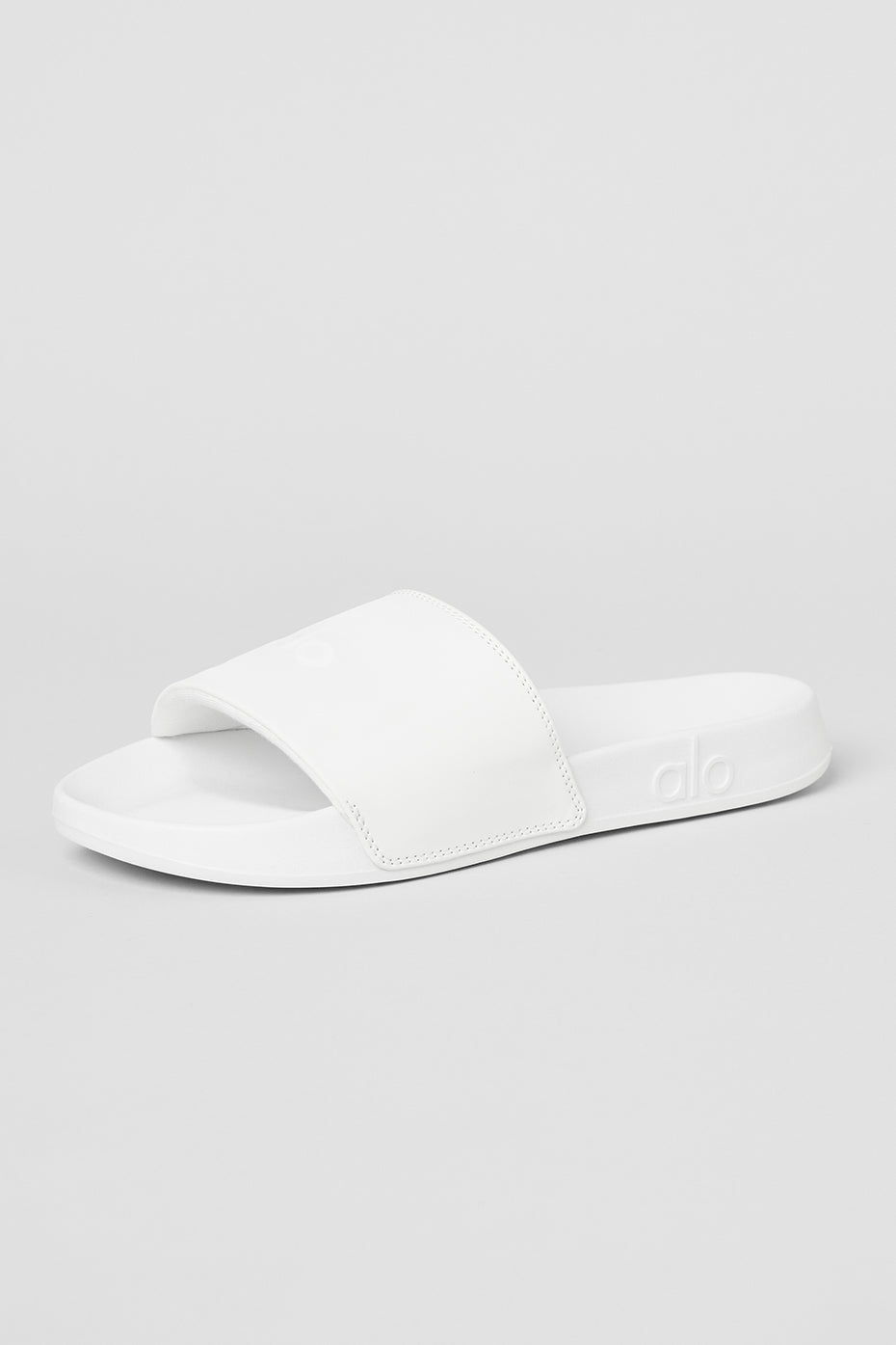 Close-up of CloudComfort white slides highlighting the padded strap.