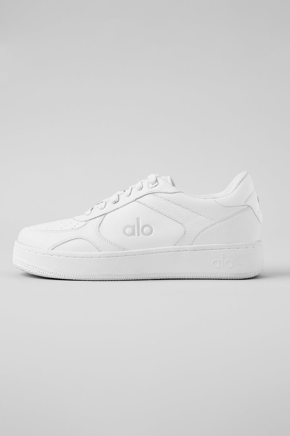 Side view of the ALO Recovery Mode vegan sneakers highlighting the supportive outsole and sleek design
