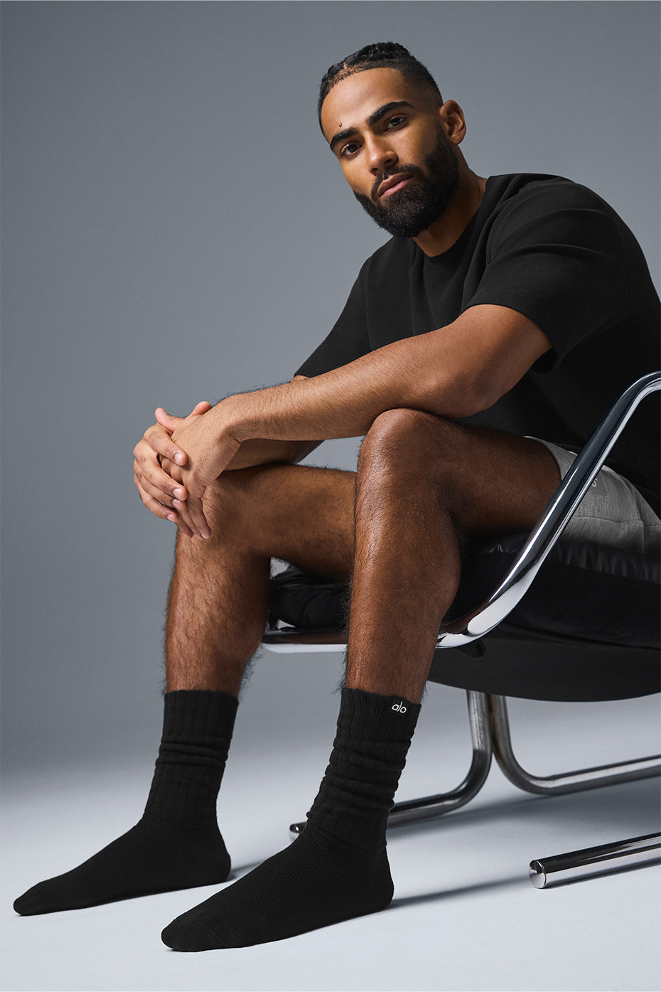 Close-up of black scrunch socks with layered leg scrunches and breathable fabric