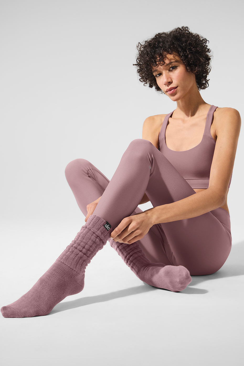 Model wearing Smoky Quartz crew socks with casual attire.