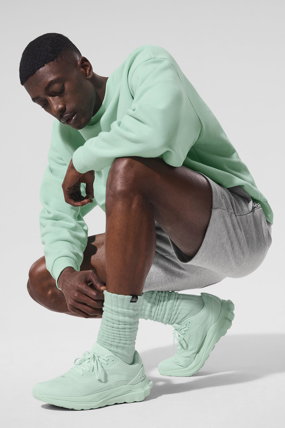 Stacked unisex socks in spearmint against neutral background for color contrast