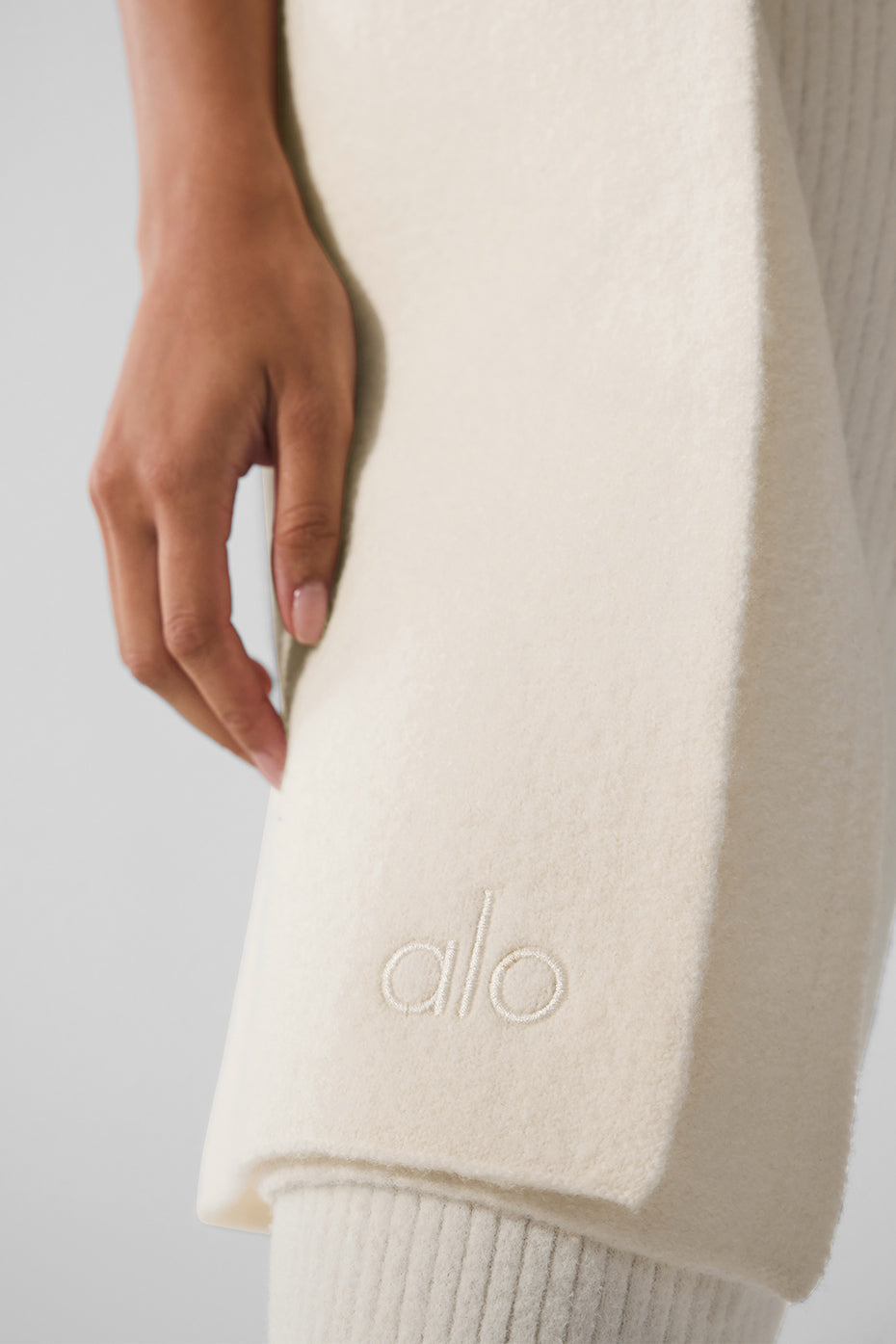 Close-up texture of merino wool scarf showing soft weave
