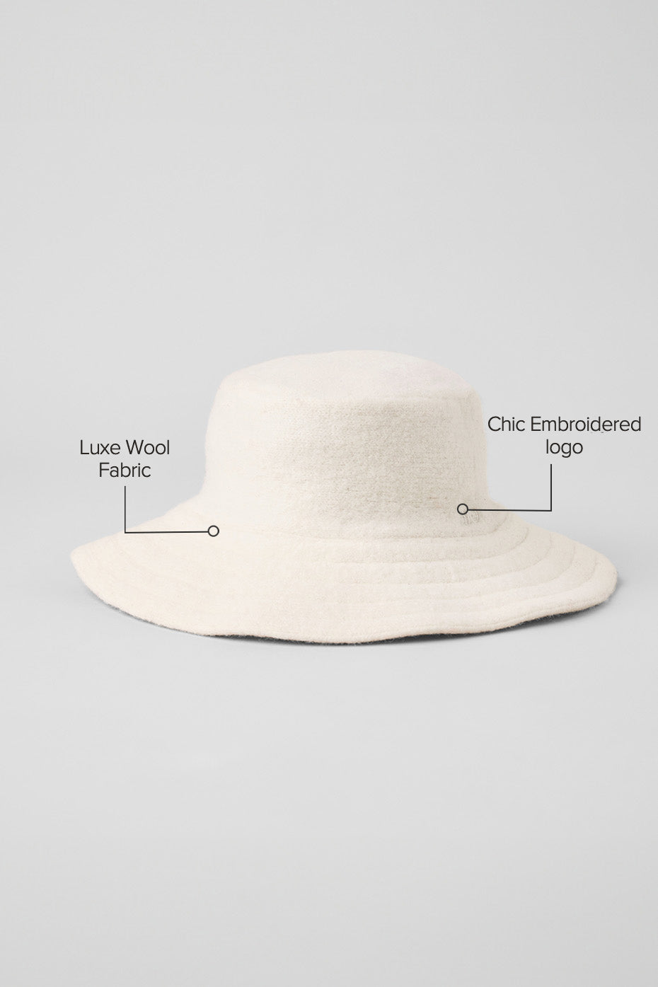 Side angle of floppy brim merino wool hat in winter attire.