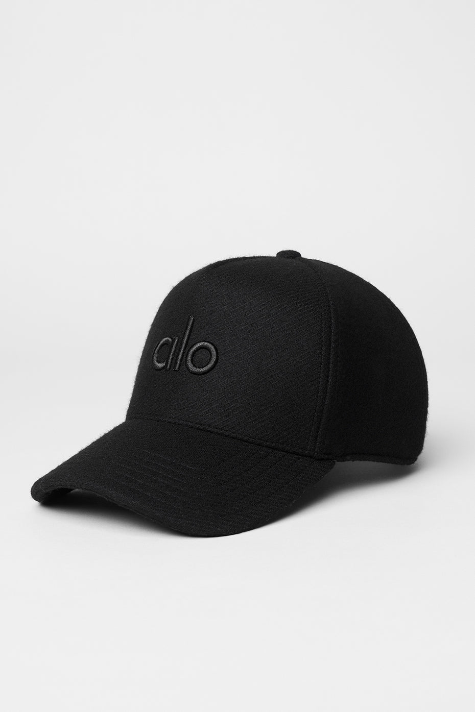 Front view of the black wool blend trucker hat, ideal for winter wear.