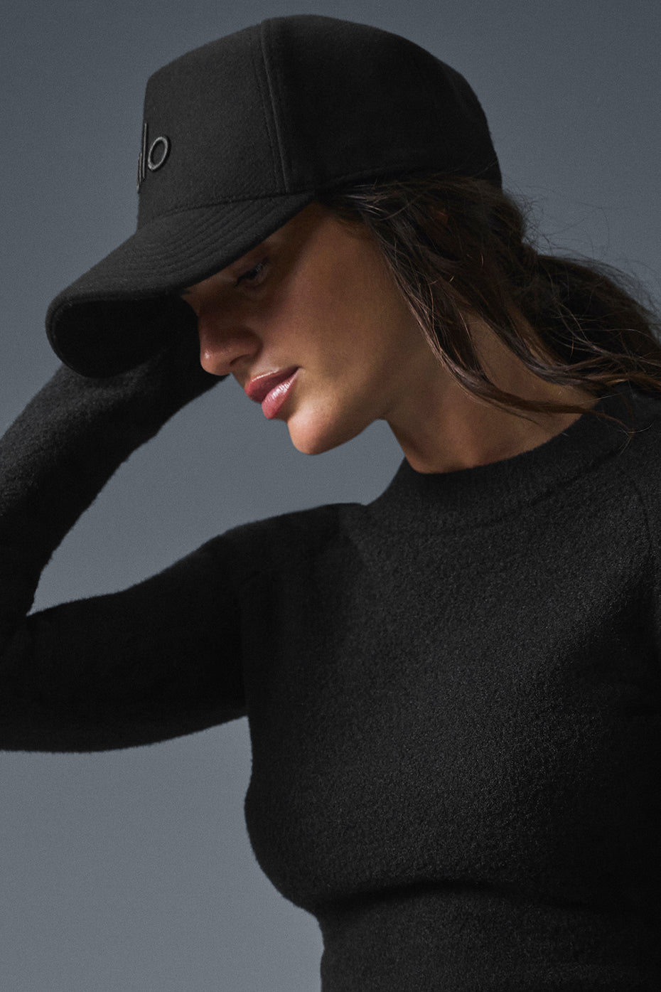 Side angle of the wool trucker hat, showcasing its stylish design.
