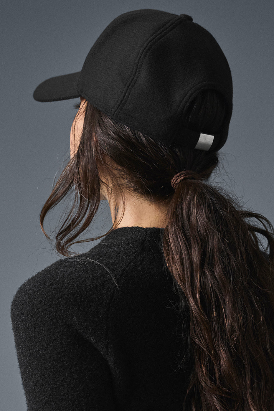 Front view of the black wool blend trucker hat, ideal for winter wear.