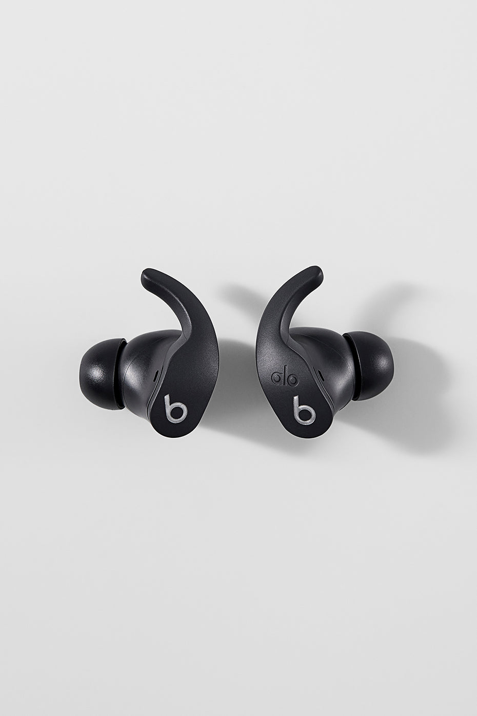 Lifestyle image featuring bluetooth earbuds with microphone during morning yoga