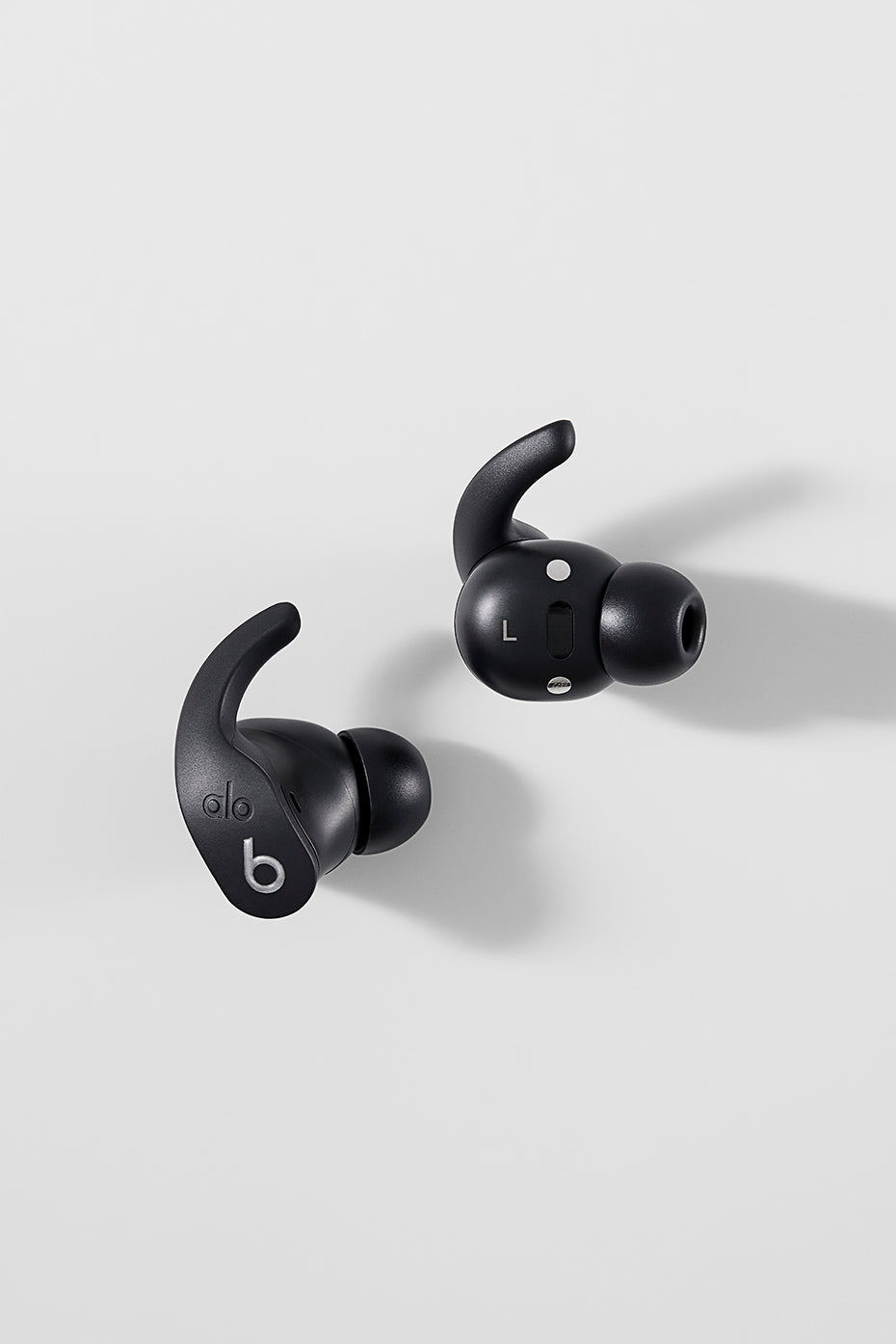 Lifestyle image featuring bluetooth earbuds with microphone during morning yoga
