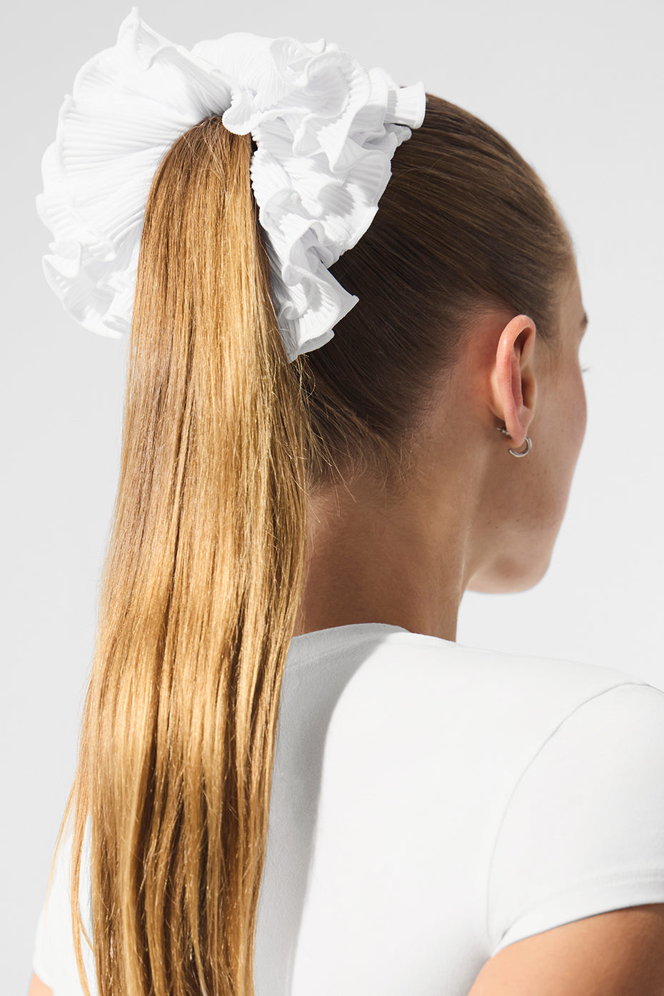 Elegant oversized scrunchie resting on a stylish vanity, highlighting its luxury.