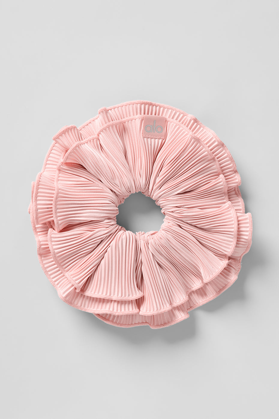 Pink quartz oversized scrunchie styled on curly hair for volume