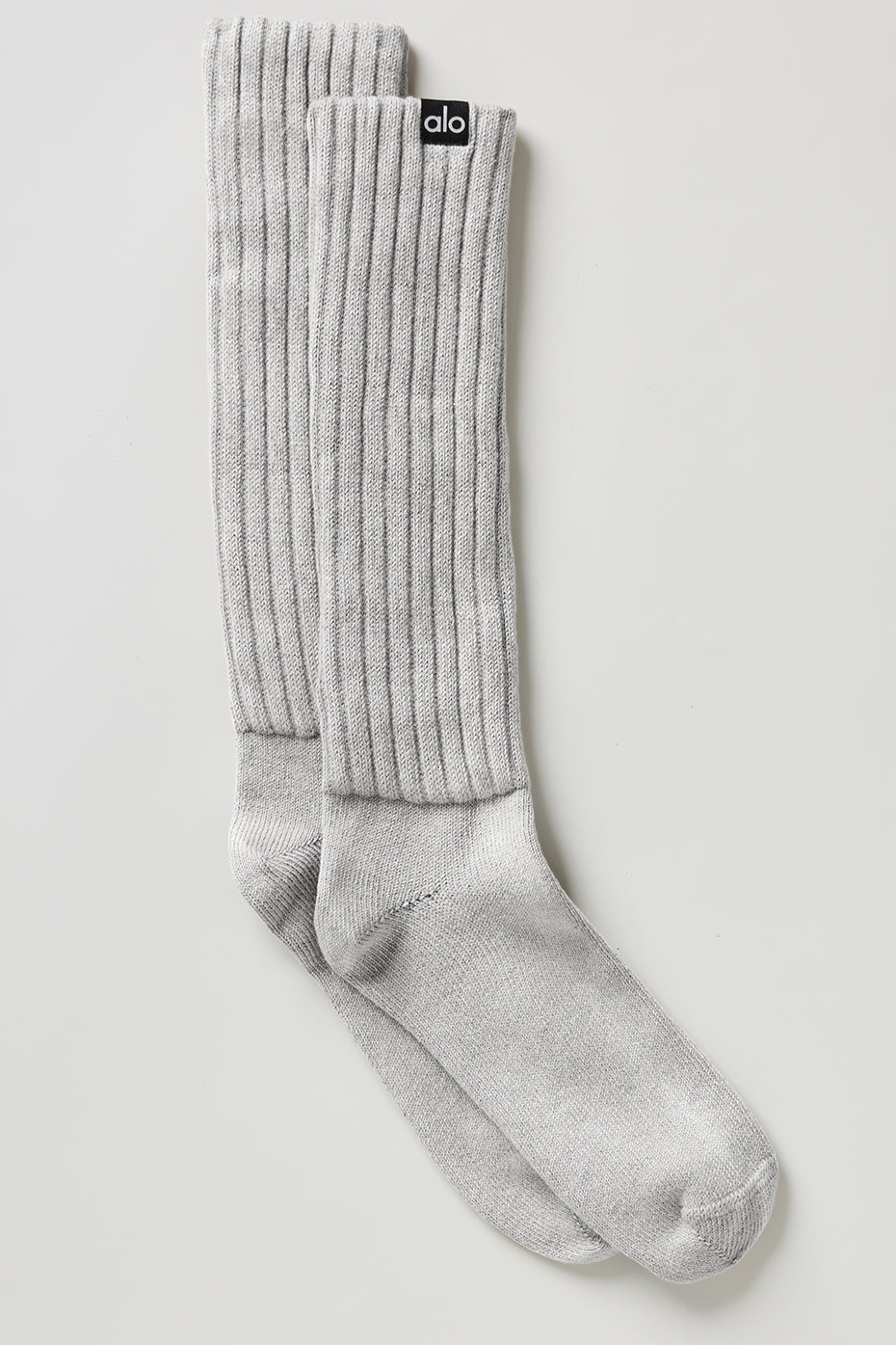 Unisex washed scrunch socks in Hazy Grey Wash styled with sneakers for casual wear