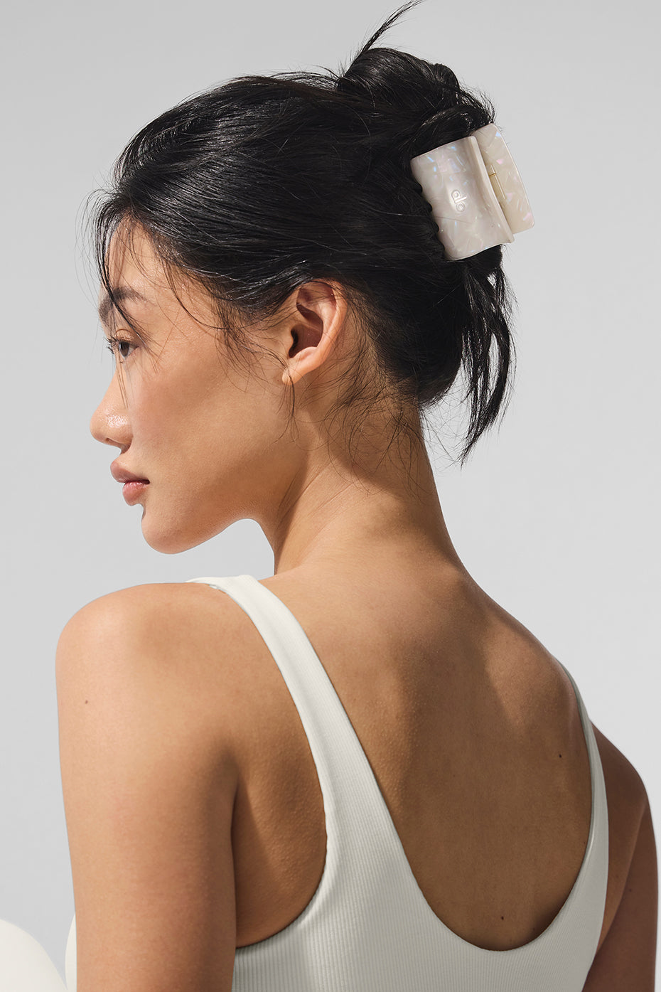 Side view of claw clip securing thick hair