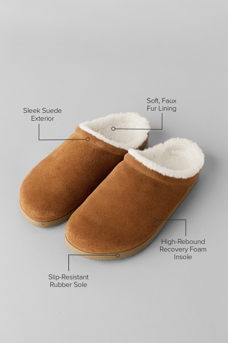 Saddle/ivory slippers paired with cozy socks for home relaxation