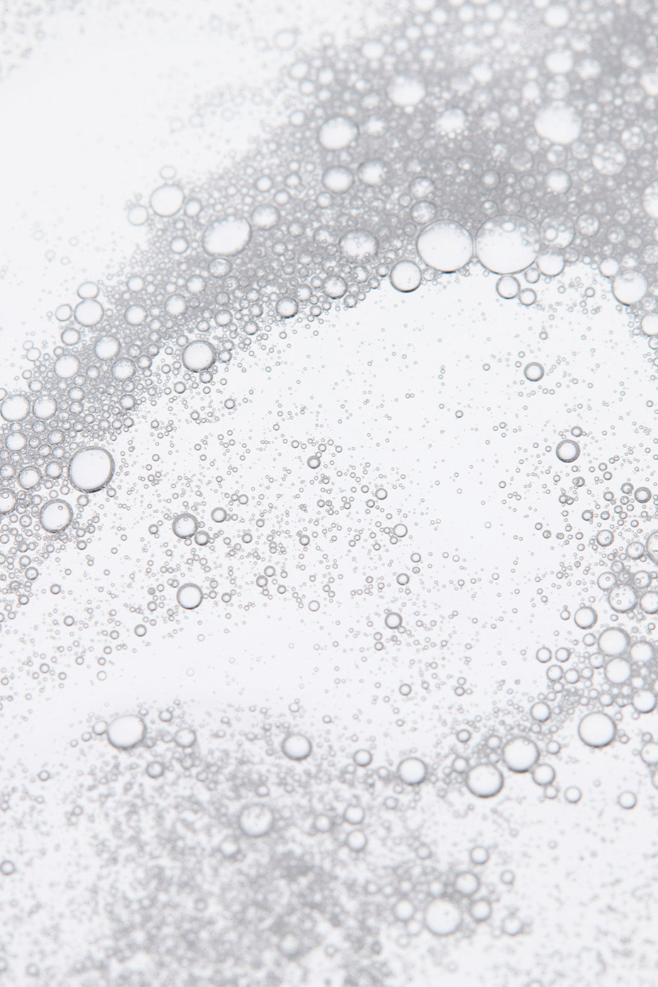 GlowRenew facial cleanser in hand, showing texture and application for daily skincare