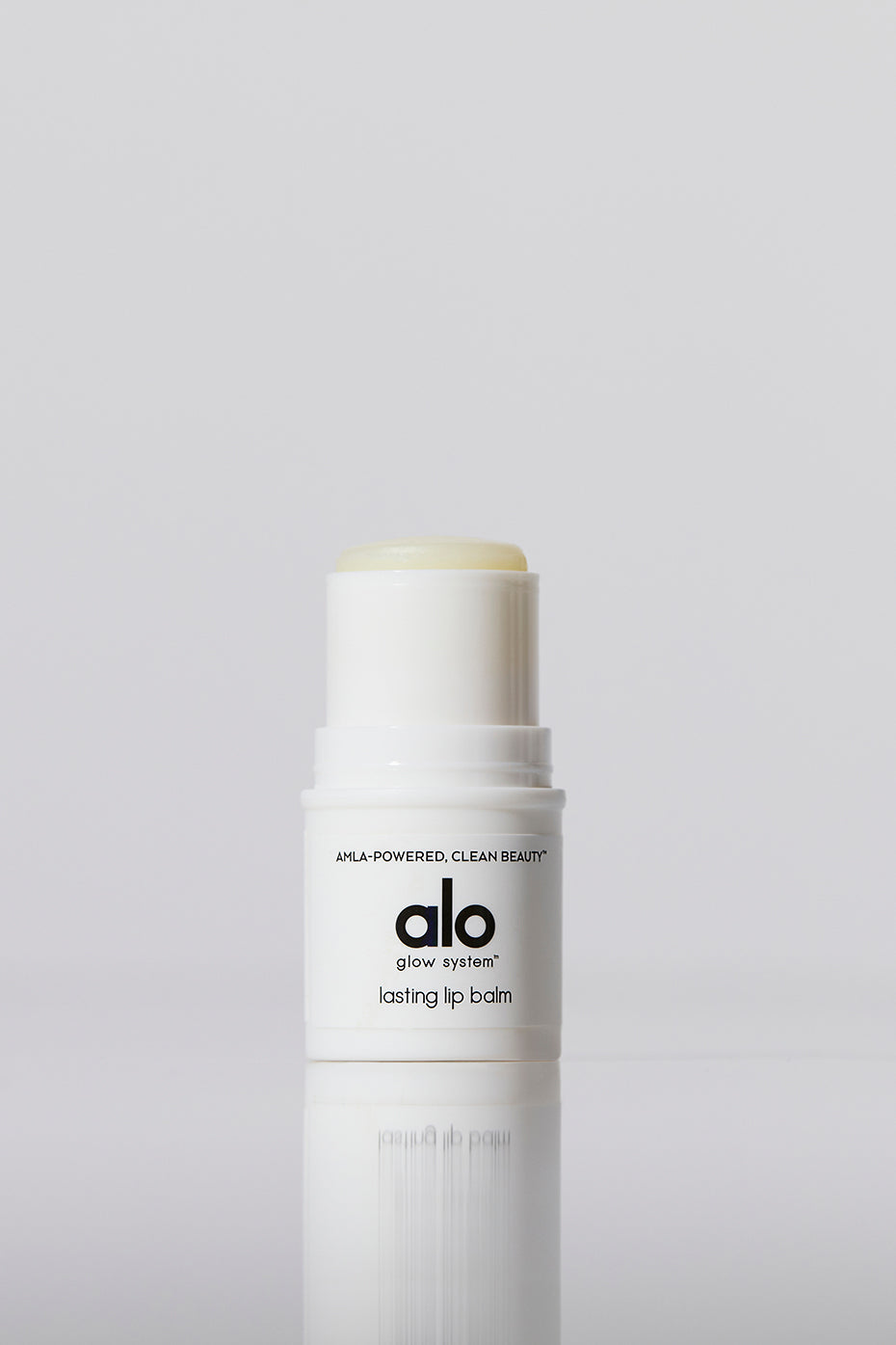 Close-up of Silky Smooth Hydrating Lip Balm on a wooden table.