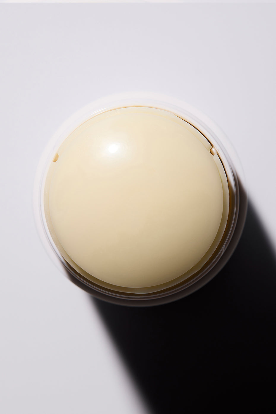Close-up of Pure Essence Unscented Deodorant bar, showcasing its smooth texture.