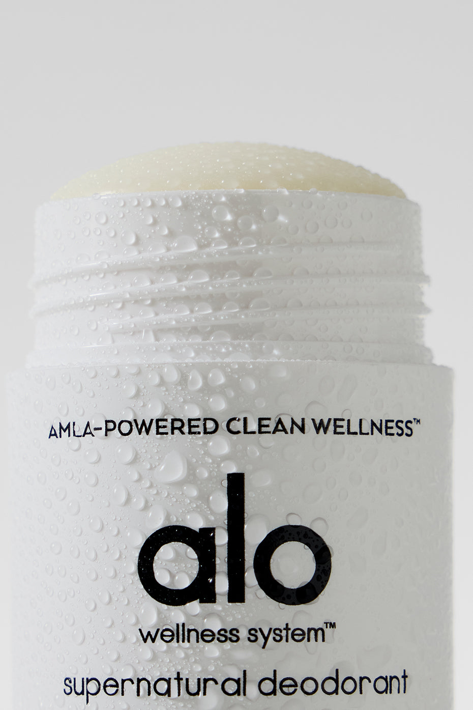 Applying natural deodorant to clean underarm for freshness