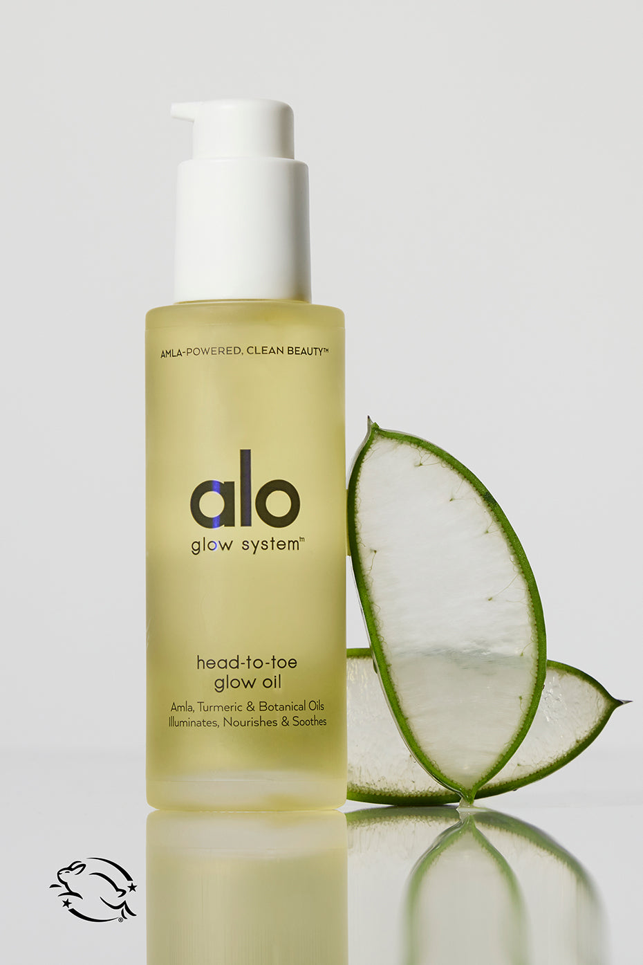 Radiant Body Glow Oil bottle displayed with natural elements.
