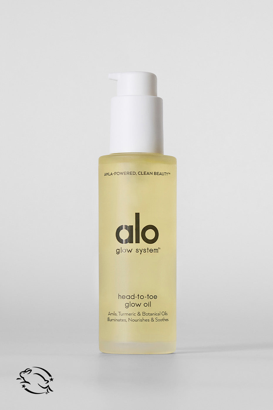 Radiant Body Glow Oil bottle displayed with natural elements.
