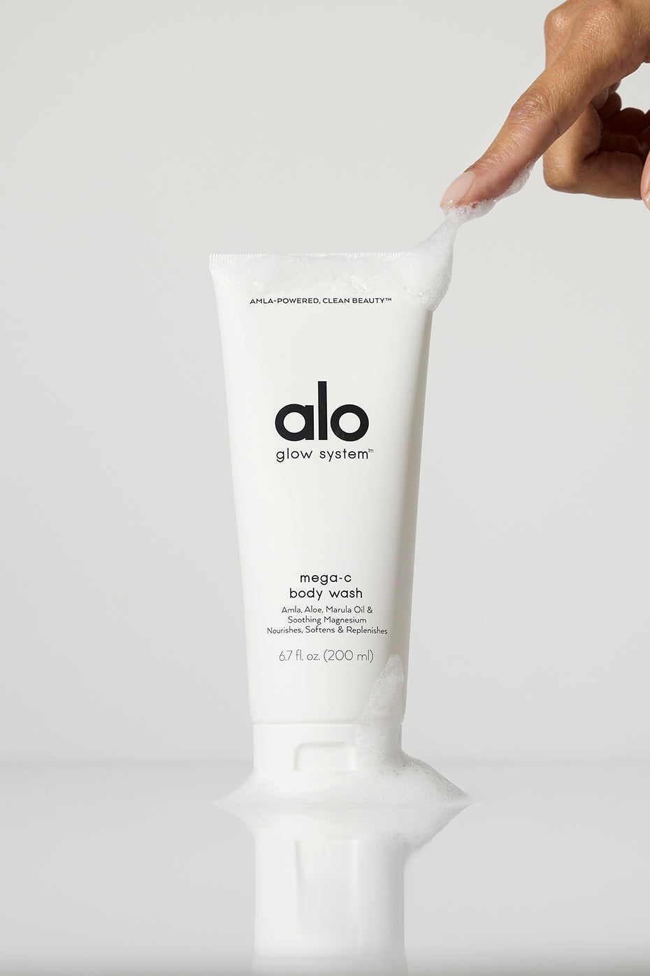 Close-up of stress relief vegan body wash with magnesium in a shower setting.