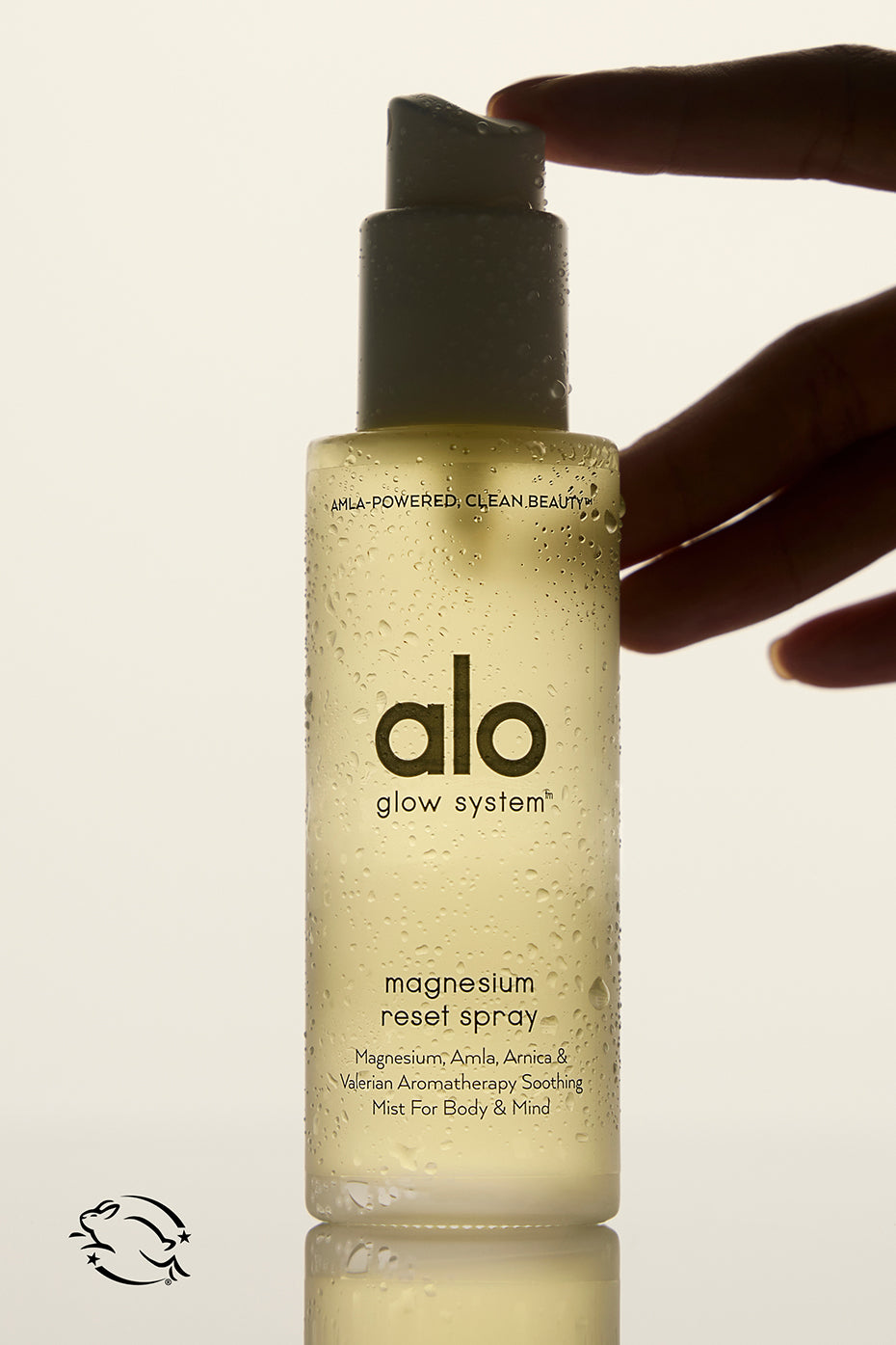 Magnesium Bliss Recovery Spray bottle on a wooden table