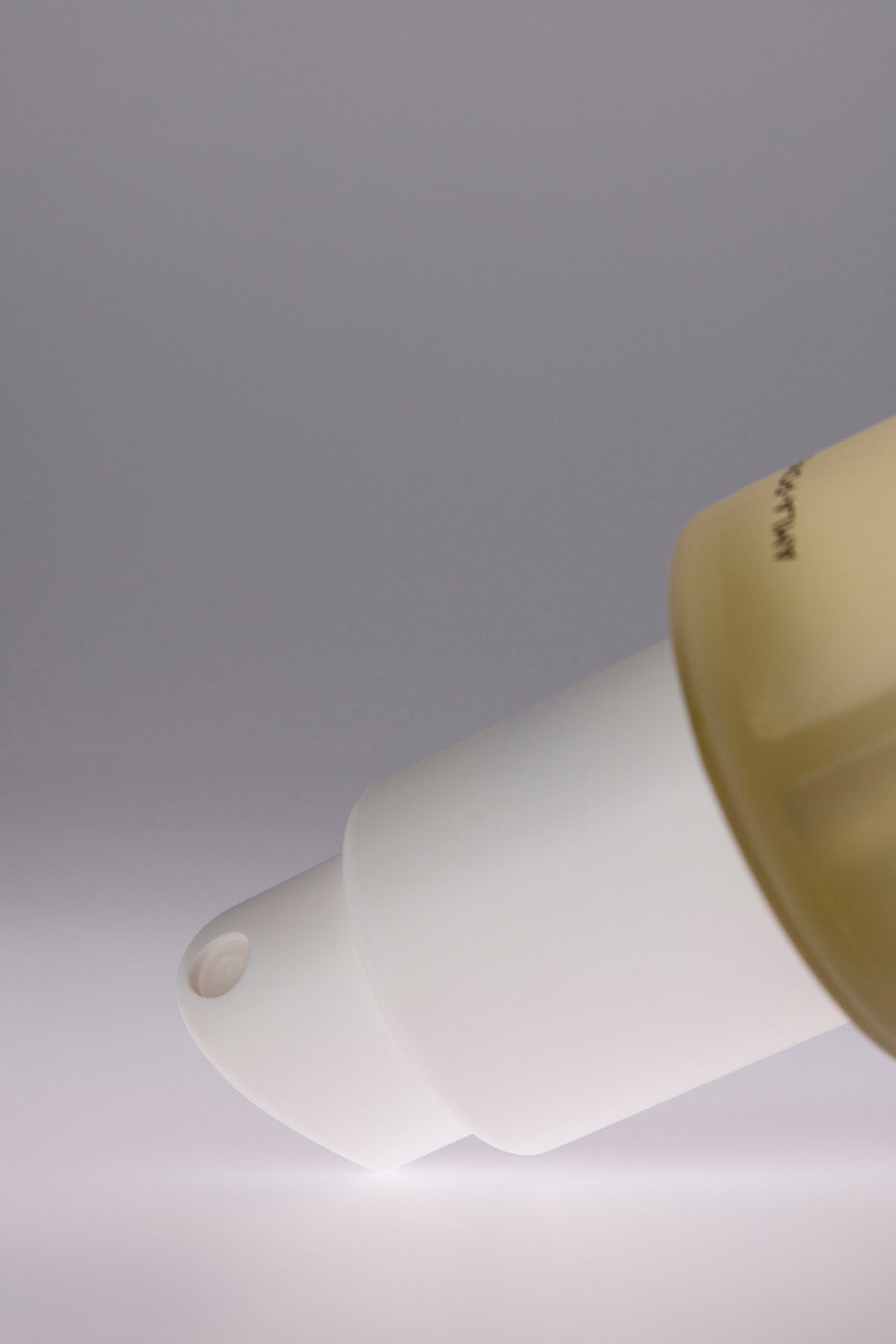 Magnesium Bliss Recovery Spray bottle on a wooden table