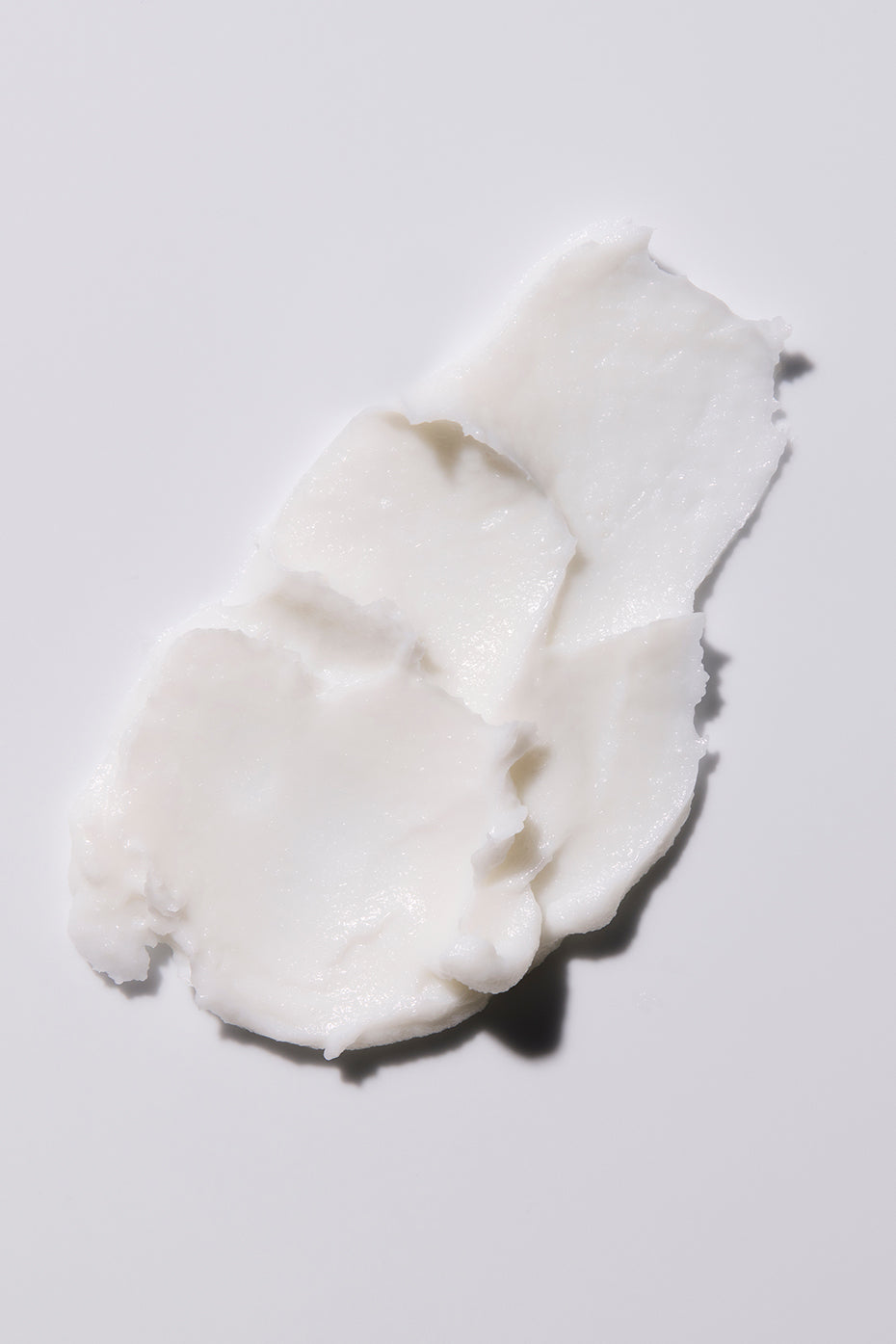Application of hand cream on dry hands for instant hydration.