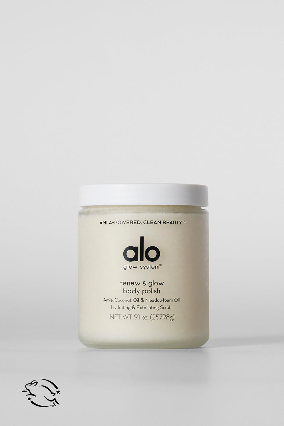 Renew & Glow Body Scrub jar on bathroom shelf with natural light