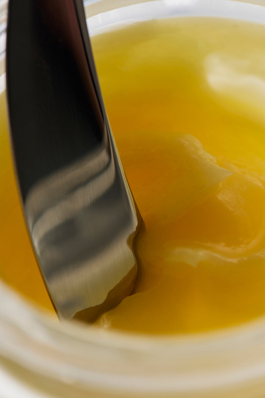Vegan all-purpose balm displayed with natural ingredients