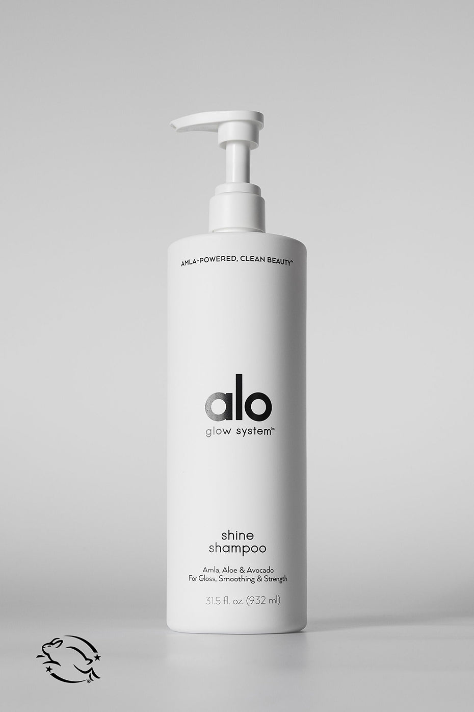 Lustrous Locks Vegan Shampoo being applied to hair in a serene bathroom setting.