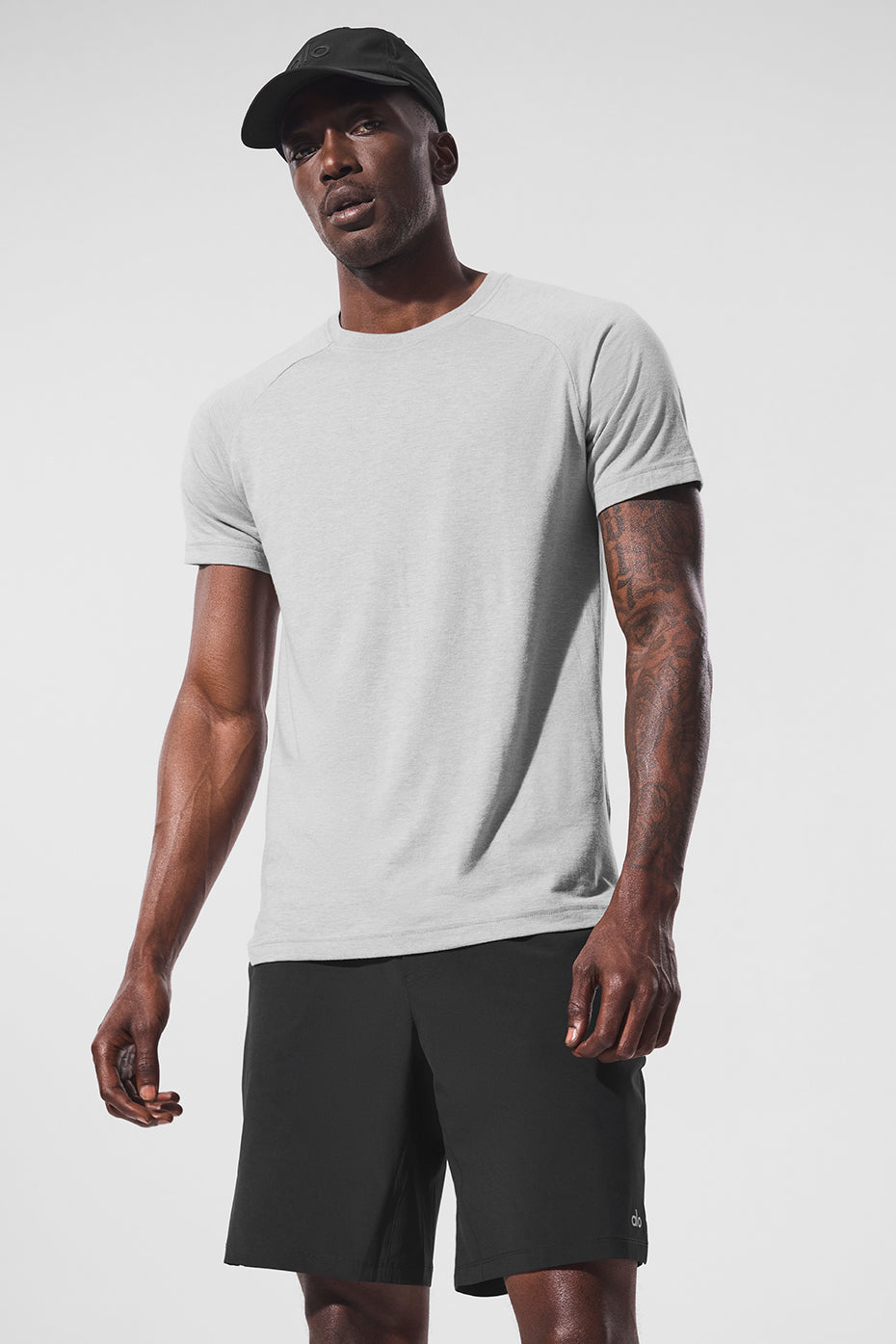 Front view of Triumph Athletic Fit Raglan Tee in Heather Grey, ideal for workouts.