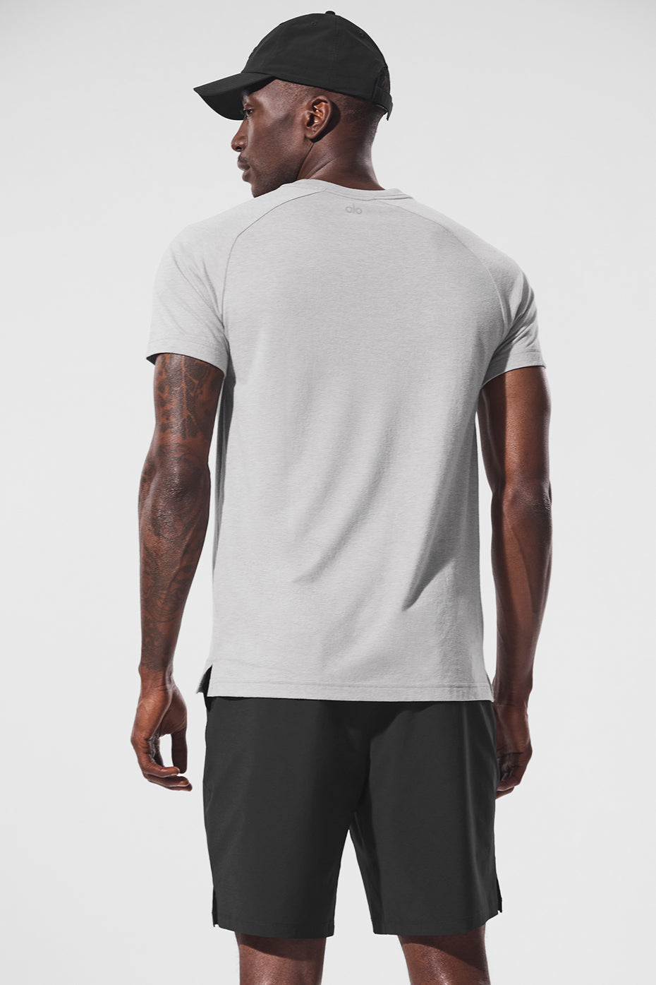 Side view of the Triumph Raglan Tee showcasing its relaxed fit and crew neck.