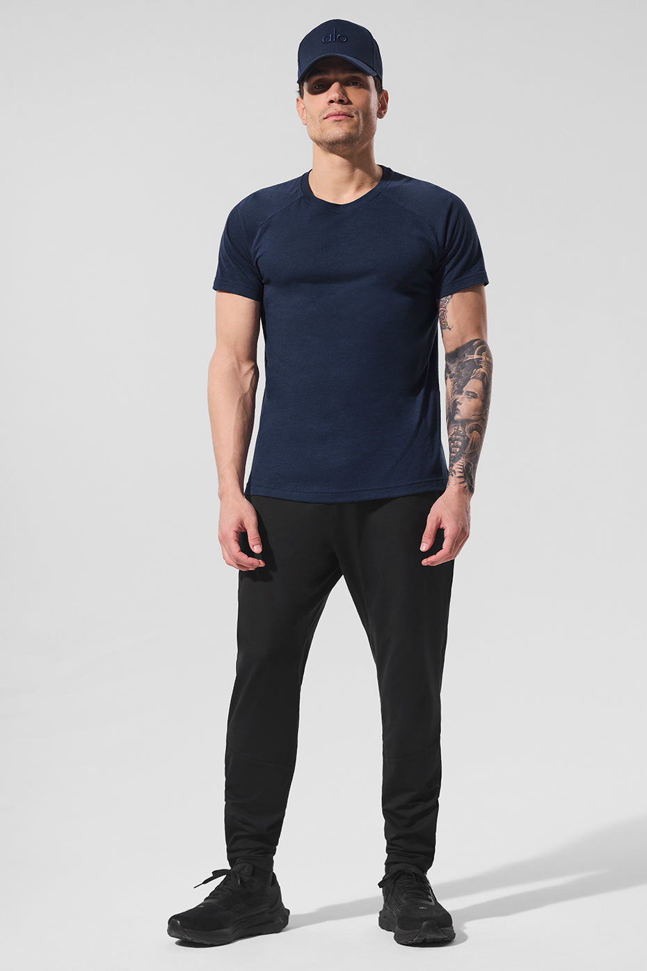 Triumph Navy Raglan Tee on a mannequin, showcasing its relaxed fit.