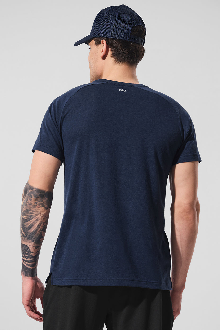 Close-up of the Triumph Navy Raglan Tees soft fabric and crew neck.