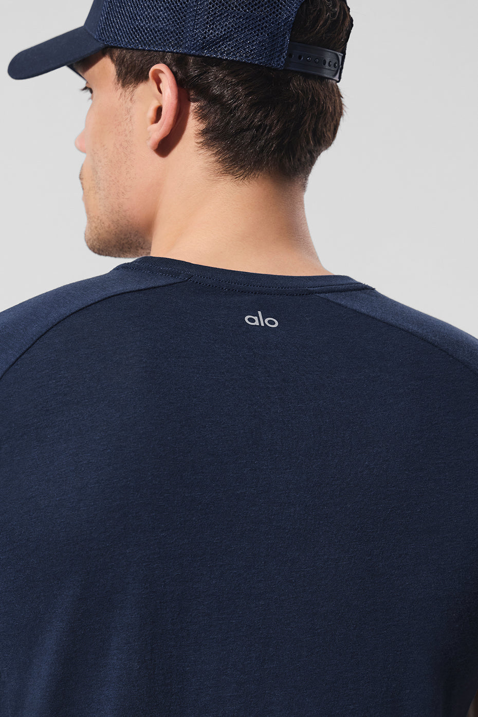Model wearing the Triumph Navy Raglan Tee in a casual setting.