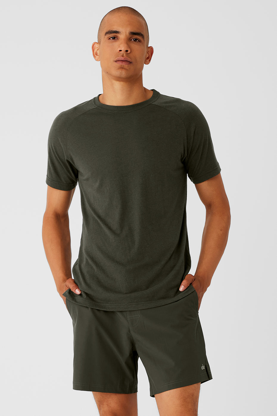 Close-up of the Triumph Slim Fit Raglan Tee in Stealth Green, highlighting the fabric texture.